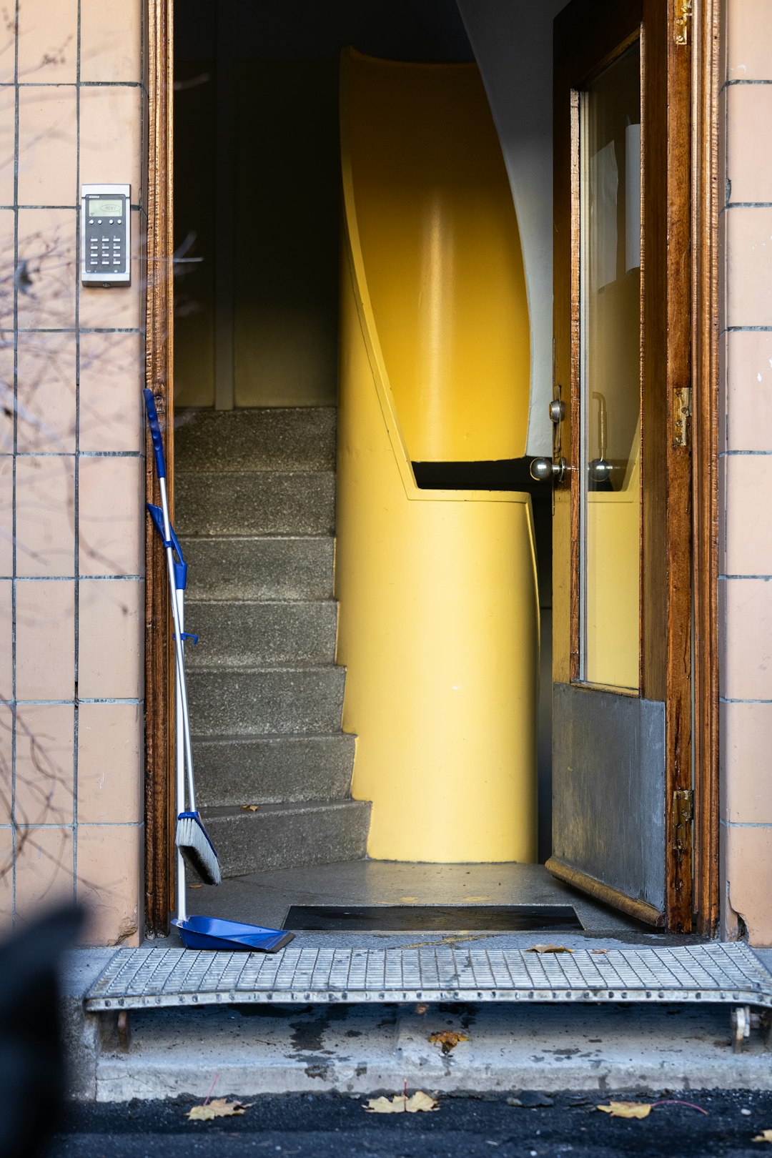 an-open-door-to-a-building-with-stairs-a4-z0lmao8y